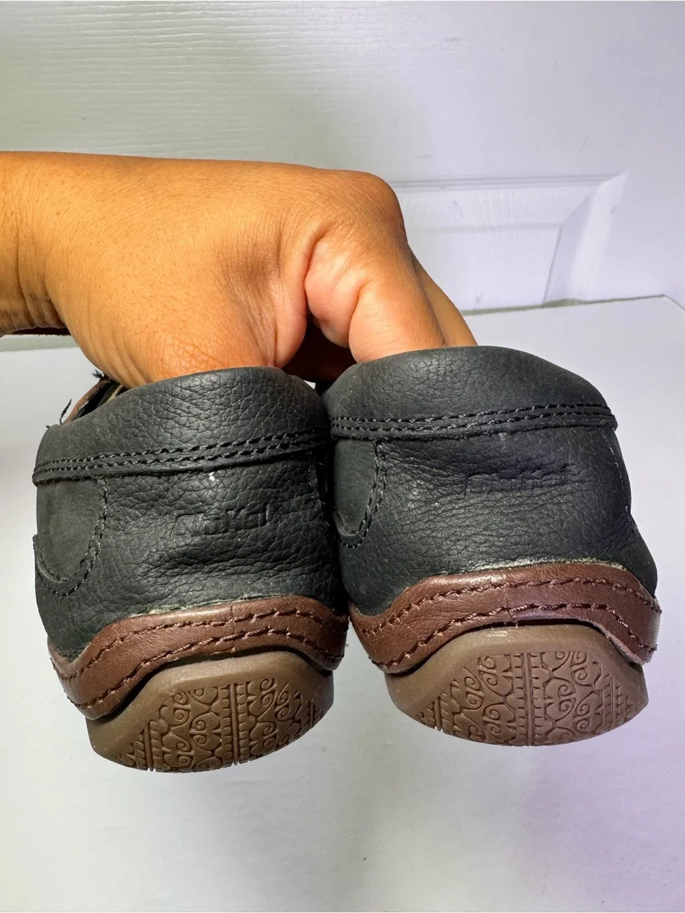 OluKai Black and Brown Leather Boat Moccasins with Tan Laces